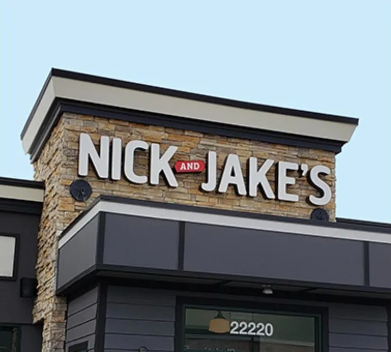 The Nick and Jake's sign on the stone tower of the Shawnee restaurant